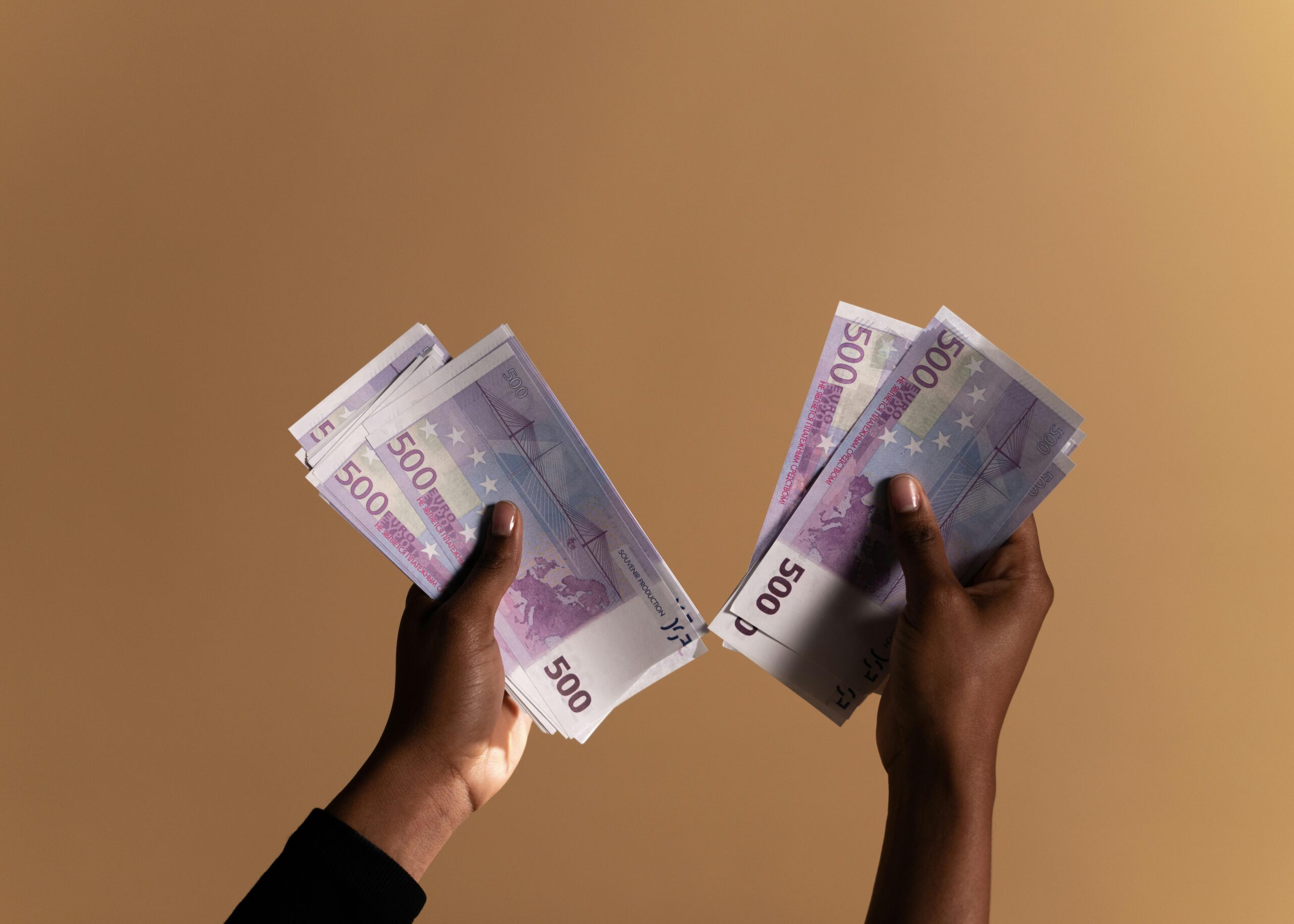 hands holding money