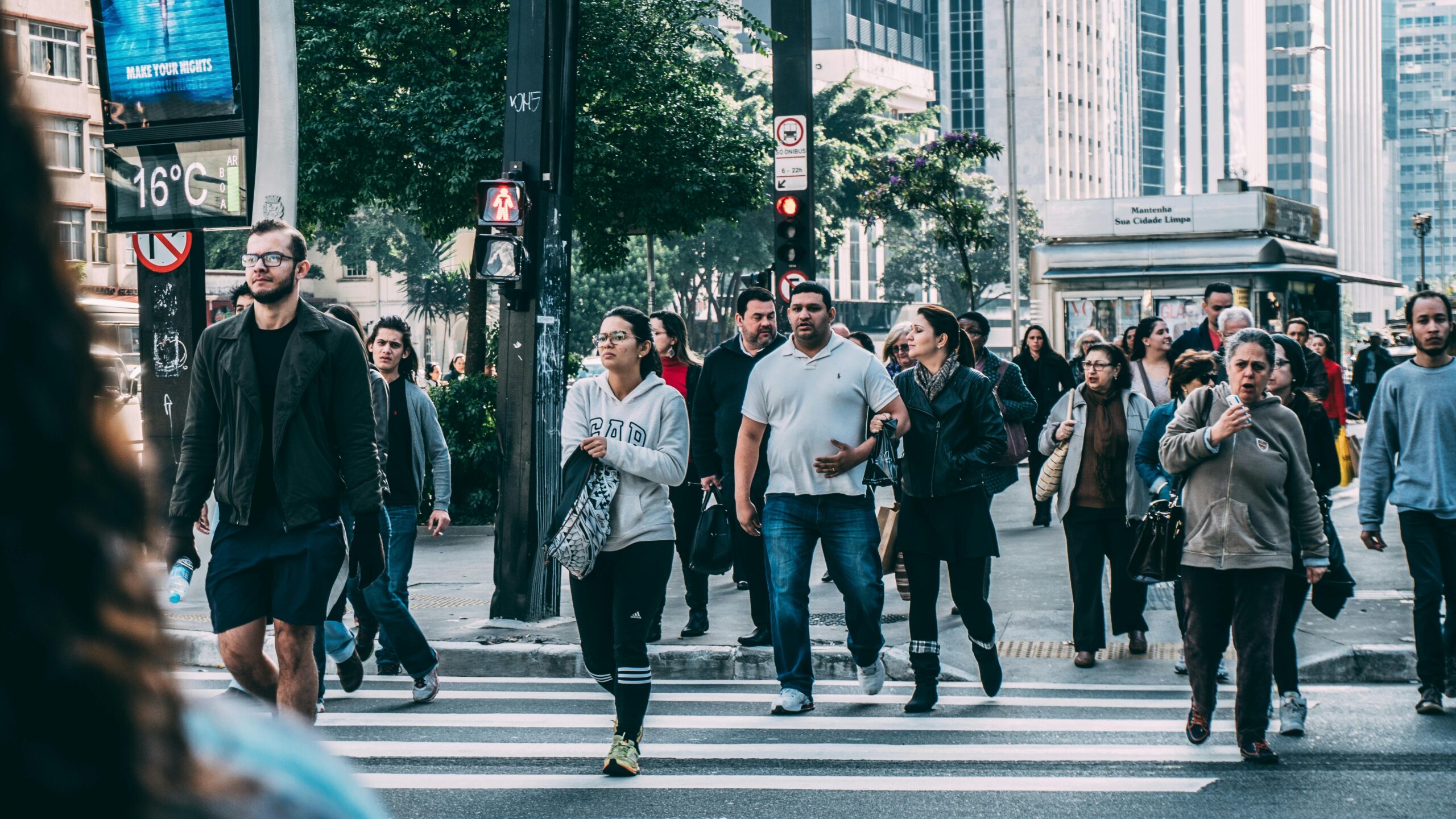 people crossing a busy street